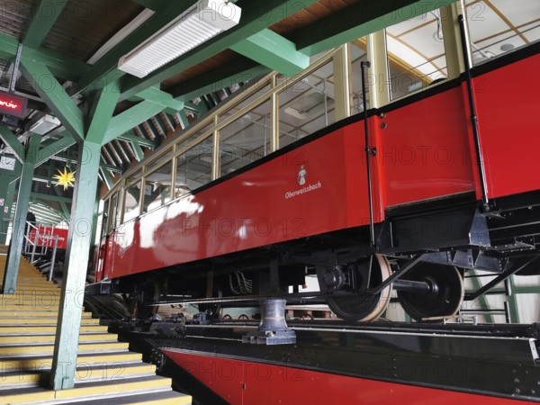 A red mountain railway is located in a wooden station, stairs lead up, Oberweissbach cable car, Rennsteig, Thuringian Forest nature park Park