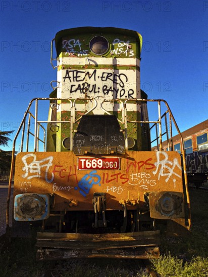 Graffiti painting, colorful locomotive at sunset, Albania