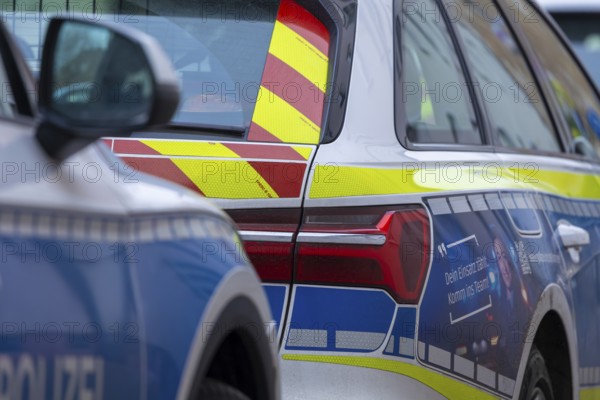Symbolic image of police operation: close-up of police emergency vehicles