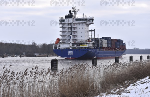 Container ship NORTH sails through the Kiel Canal, NOK, Kiel Canal, Schleswig-Holstein, Germany in winter