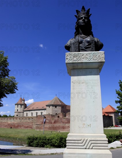 Statue of Doamna Stanca, a princess woman of Wallachia, Transylvania and Moldova as woman of Michael the Brave in front of Fagarash fortress, Cetatea Fagarasului, a historical monument, construction began in 1310, in the city of Fagaras, the fortress is now home to the Museum of the Fagara Land, Brasov District, Transylvania, Romania