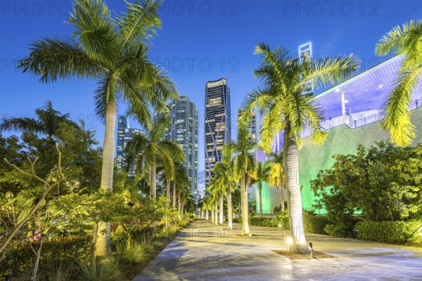 Miami skyline with high-rise real estate at night at Maurice A. Ferre Park in Miami, USA