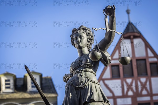 Justice, statue of the Roman goddess of justice. Römerberg, Downtown Frankfurt am Main, Hesse, Germany