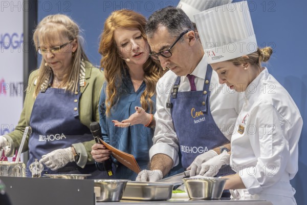 Cem is cooking! DEHOGA Baden-Württemberg event with candidate for the post of Minister-President, Cem Özdemir. The Green Party candidate is assisted by Beate Gaiser from the Hotel Adler in Freudenstadt, chairwoman of the DEHOGA Freudenstadt district association. INTERGASTRA, leading trade fair for the hotel and catering industry. Stuttgart, Baden-Württemberg, Germany