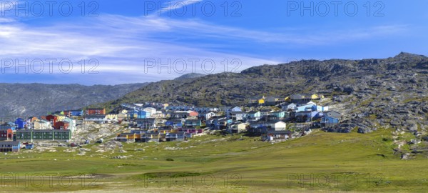 Typical architecture of Greenland Ilulissat with colored houses located near fjords and icebergs
