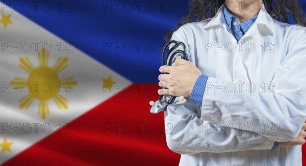Healthcare professional with Philippines flag background. Professional doctor holding stethoscope on Philippines flag background