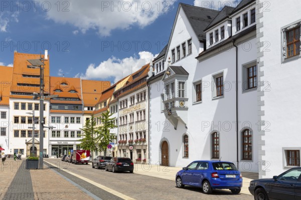 North side of the Obermarkt with historic town houses and Renaissance façade of the town hall with heraldic bay window and gaffhead, Freiberg, Saxony, Germany
