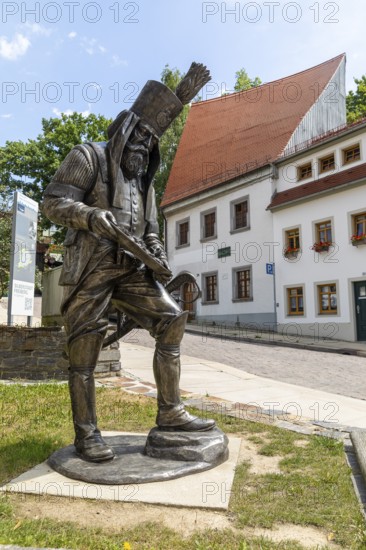 Silver figure Happy Miner by Friedhelm Schelter on Schüppchenberg, stop on the Siberweg adventure trail through the old town of Freiberg, Saxony, Germany