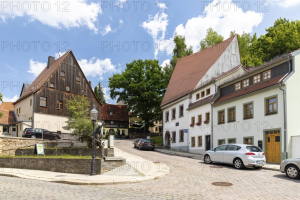 Silver figure Happy Miner by Friedhelm Schelter on Schüppchenberg, stop on the Siberweg adventure trail through the old town of Freiberg, Saxony, Germany
