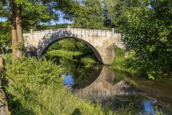 Historic arched bridge over the Mandau in Hainewalde, Upper Lusatia, Saxony, Germany