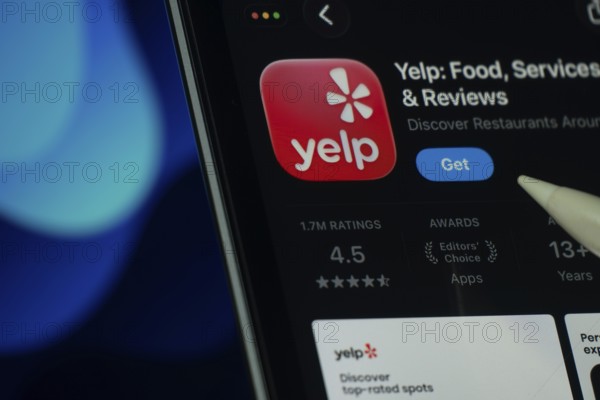 Dhaka, Bangladesh- 24 Oct 2025: A iPad screen displaying the Yelp app on App store