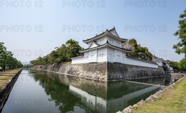 Tonan Sumi-yagura, southeastern watchtower, reflected in the water of the moat, former imperial villa, Nijo Castle, Kyoto, Japan