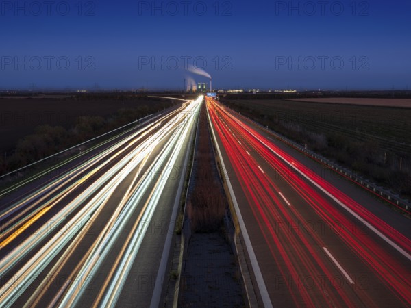 Night shot, long exposure, light trails on the A38 motorway, Schkopau power plant in the back, Saxony-Anhalt, Germany
