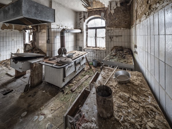 Dilapidated kitchen full of rubble in an abandoned country inn, Lost Place, Saxony-Anhalt, Germany