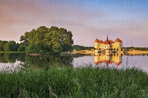 Moritzburg Castle, Augusts the Strong hunting lodge in the evening light, water reflection in the lake, Saxony, Germany