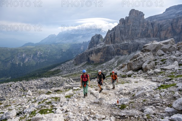 Climbers on a hiking trail, rocky mountain landscape, Via Ferrata SOSAT via ferrata, Brenta Mountains, Trentino, Italy