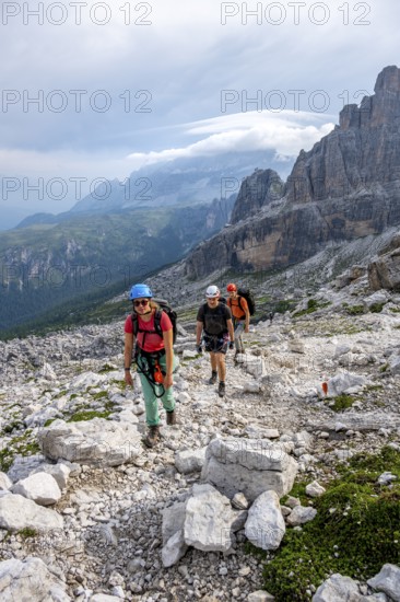 Climbers on a hiking trail, rocky mountain landscape, Via Ferrata SOSAT via ferrata, Brenta Mountains, Trentino, Italy