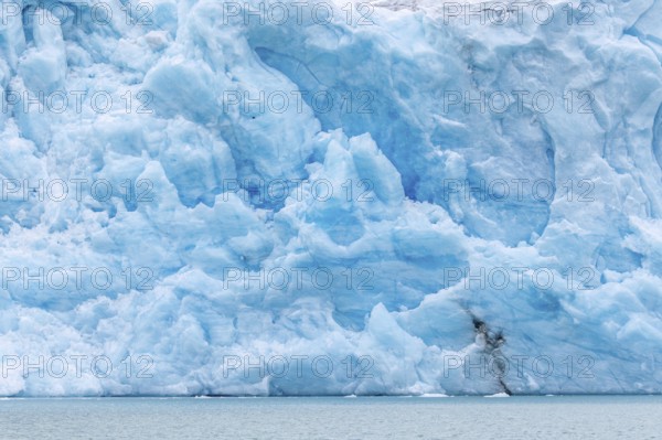 Blue ice wall of Idabreen, Ida glacier calving into Liefdefjorden at Idabukta bay, Haakon VII Land, Spitsbergen, Svalbard, Norway