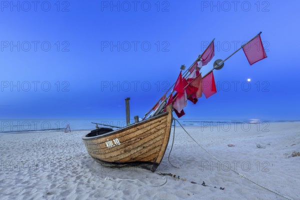 Traditional wooden fishing boat on the beach along the Baltic Sea at Stubbenfelde, Loddin on the island Usedom, Mecklenburg–Western Pomerania, Germany