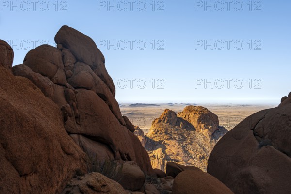 Dramatic rock formations with views of vast desert landscape under clear skies in Spitzkoppe, Spitzkoppe, Namibia