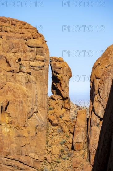 Distinctive rock formation with blue sky and barren desert landscape in Spitzkoppe, Spitzkoppe, Namibia