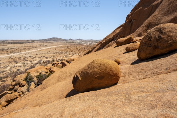 Extensive desert landscape with distinctive rock formations and endless expanse, Spitzkoppe, Namibia