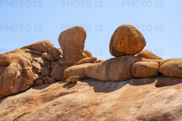 Impressive rock formations rise against a bright blue sky, Spitzkoppe, Namibia