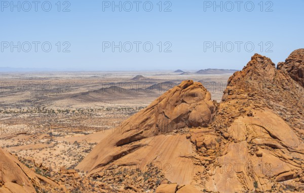 Endless desert landscape with dramatic rock formations and wide horizons, Spitzkoppe, Namibia
