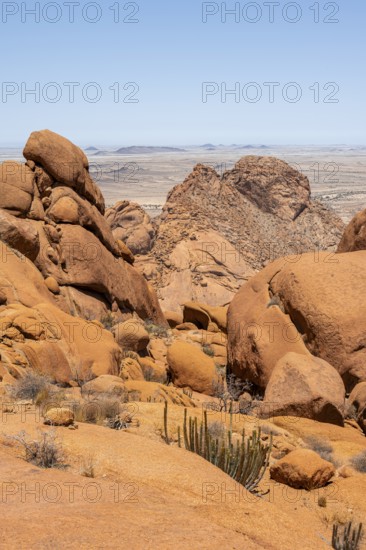 Rocks under a blue sky in the dry desert landscape of Spitzkoppe, Spitzkoppe, Erongo, Namibia