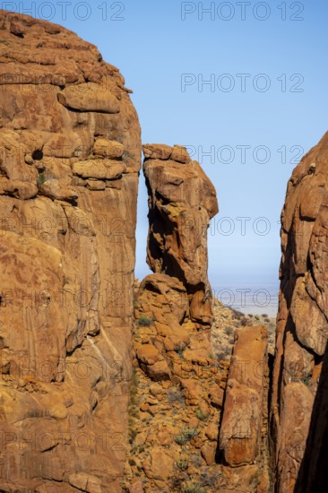 Gorge-like rock formations under bright blue sky in Spitzkoppe, Spitzkoppe, Namibia