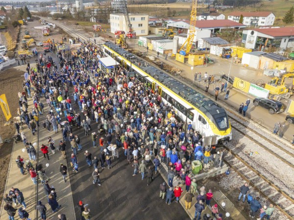 Many people at an event with train and construction site near a train station, opening of the Hermann Hesse Railway, Calw, Germany