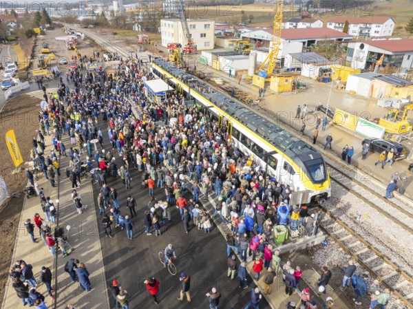 Large crowd at an event with train and cranes on a construction site, opening of the Hermann Hesse Railway, Calw, Germany