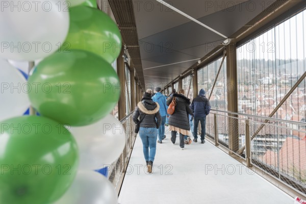 A walkway with people and balloons overlooks the city, opening of the Hermann Hesse Railway, Calw, Germany