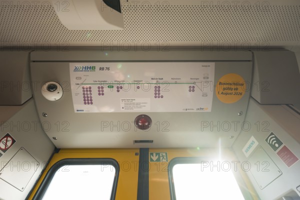 The interior of a train with a route plan and lighting on the ceiling, opening of the Hermann Hesse Railway, Calw, Germany