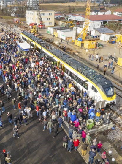 Assembly of people at a construction site event with a train, opening of the Hermann Hesse Railway, Calw, Germany