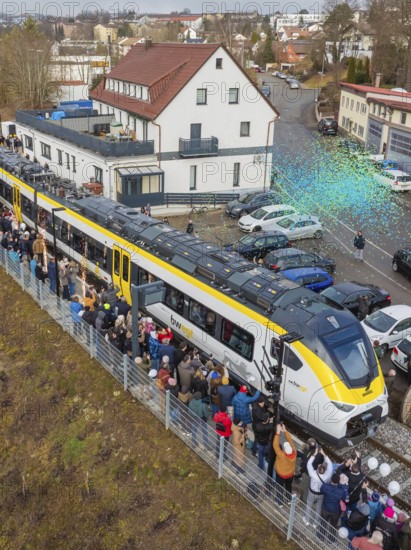 Train surrounded by a crowd in an urban area, aerial view, opening of the Hermann Hesse Railway, Calw, Germany