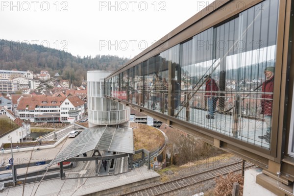 A glazed bridge with a view of the city's buildings, opening of the Hermann Hesse Railway, Calw, Germany