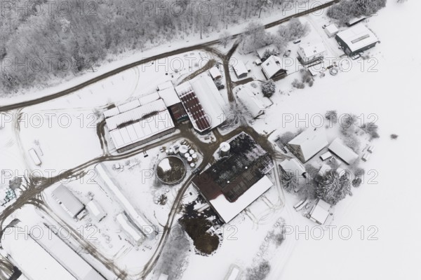 Farm from above in a snowy winter landscape with snow-covered roofs, Haselstaller Hof, Gechingen, Calw district, Germany