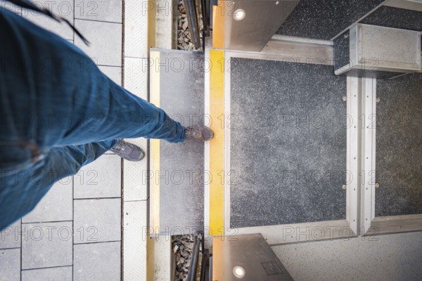 Person boarding a train, view from above of the entrance, Siemens Micro Plus B battery electric train, Hermann, Hesse, Bahn, Weil der Stadt, Böblingen district, Germany