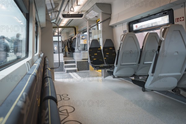 Modern, empty interior view of a train with grey and yellow seats, Siemens Micro Plus B battery electric train, Hermann, Hesse, Bahn, Weil der Stadt, Böblingen district, Germany