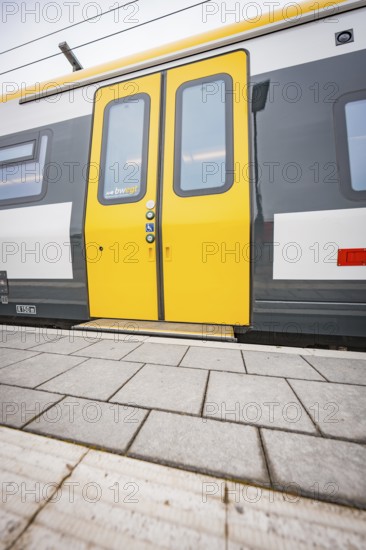 Close-up of a yellow train door on a platform, Siemens Micro Plus B battery electric train, Hermann, Hesse, Bahn, Weil der Stadt, Böblingen district, Germany