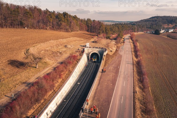 Aerial view of a railway tunnel next to a road and emergency services surrounded by trees, fire drill on the Hermann Hesse Railway, Ostelsheim, Germany