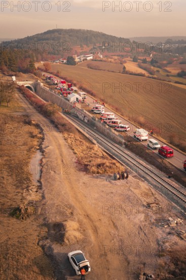 Aerial view of rural scenery with vehicles, tunnels and hills in the background, fire drill on the Hermann-Hesse railway, Ostelsheim, Germany
