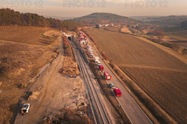 Aerial view with emergency vehicles next to a tunnel and fields in the background, fire drill at the Hermann-Hesse Railway, Ostelsheim, Germany