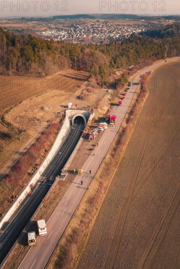 Aerial view of a tunnel with emergency vehicles and barriers along the road, fire drill on the Hermann-Hesse railway, Ostelsheim, Germany