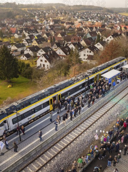 Train in rural areas stops along the platform with numerous observers, opening of the Hermann Hesse Railway, Calw, Germany