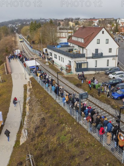 Numerous people lining up along the tracks in a village, opening of the Hermann Hesse Railway, Calw, Germany