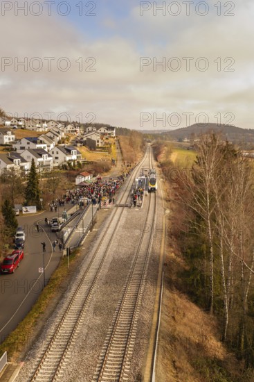 Rural railway line with crowds and a waiting train, opening of the Hermann Hesse Railway, Calw, Germany