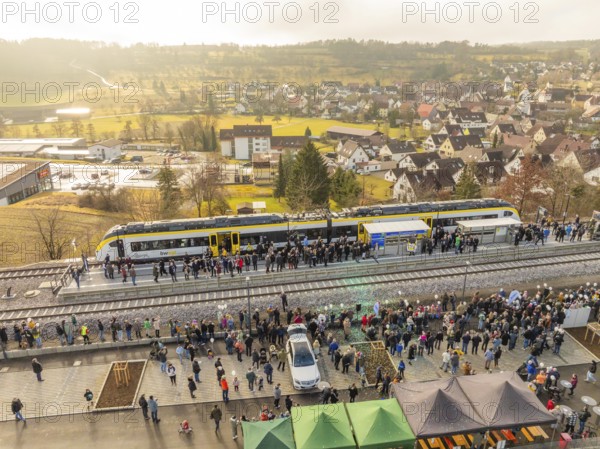 Numerous people at a village train station, festive atmosphere upon arrival by train, opening of the Hermann Hesse Railway, Calw, Germany