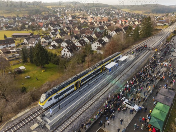 A train on a platform in a village, surrounded by a large crowd, opening of the Hermann Hesse Railway, Calw, Germany